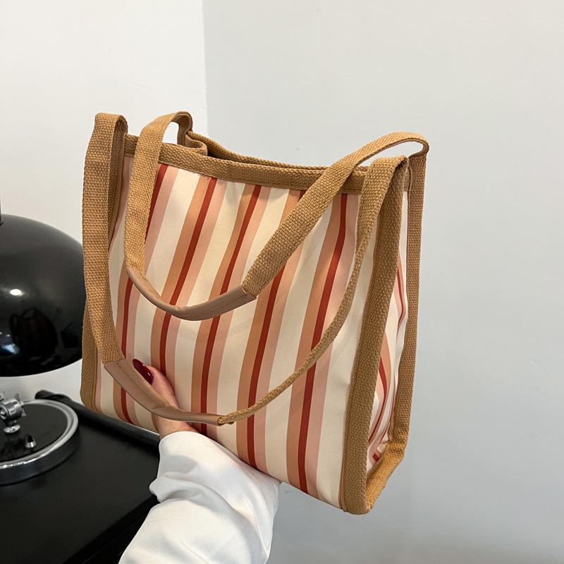 

Commuter large-capacity fashion striped new casual tote bag women s personality foreign style design sense student shoulder bag хаки