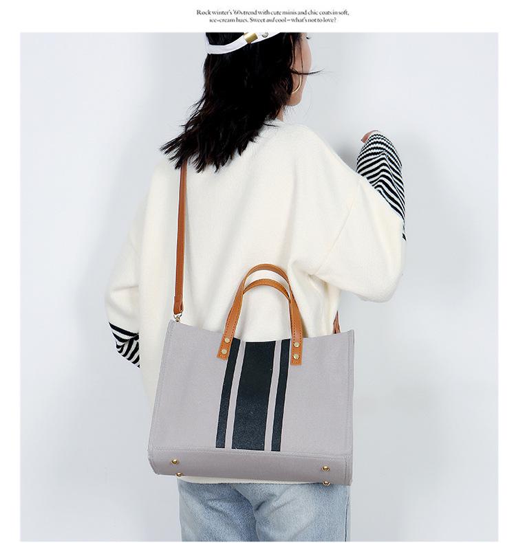 Korean-Style Striped Canvas Shoulder Bag: Women's Minimalist Professional Handbag with Large Capacity.