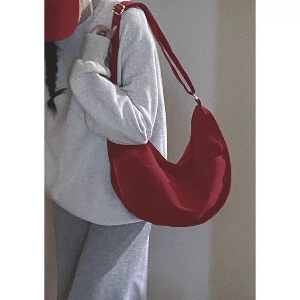 Canvas bag women's large capacity 2025 new casual niche design shoulder messenger bag student commuter dumpling bag