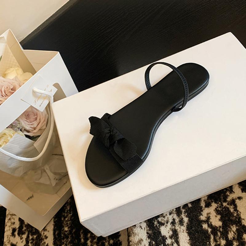 Fashion famous fabric bowtie flat sandals women black ankle strap gladiator sandalias mujer elastic band sandalias de mujer verano 2025
