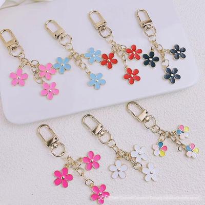 Portachiavi estivo europeo e americano con fiore color goccia d'olio, per cellulari, borse e auto.