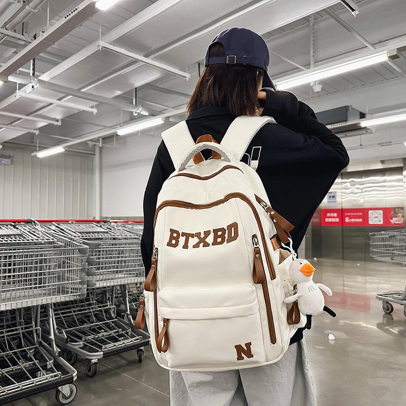 Large-capacity multi-layer schoolbag, junior high school students, girls, boys, high school students, load reduction ridge protection