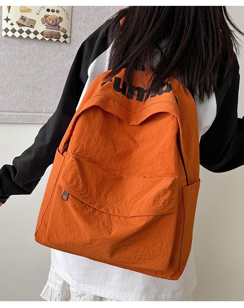 Lightweight Minimalist Backpack for Female Students: Versatile Double-Shoulder Bag for School and Travel.