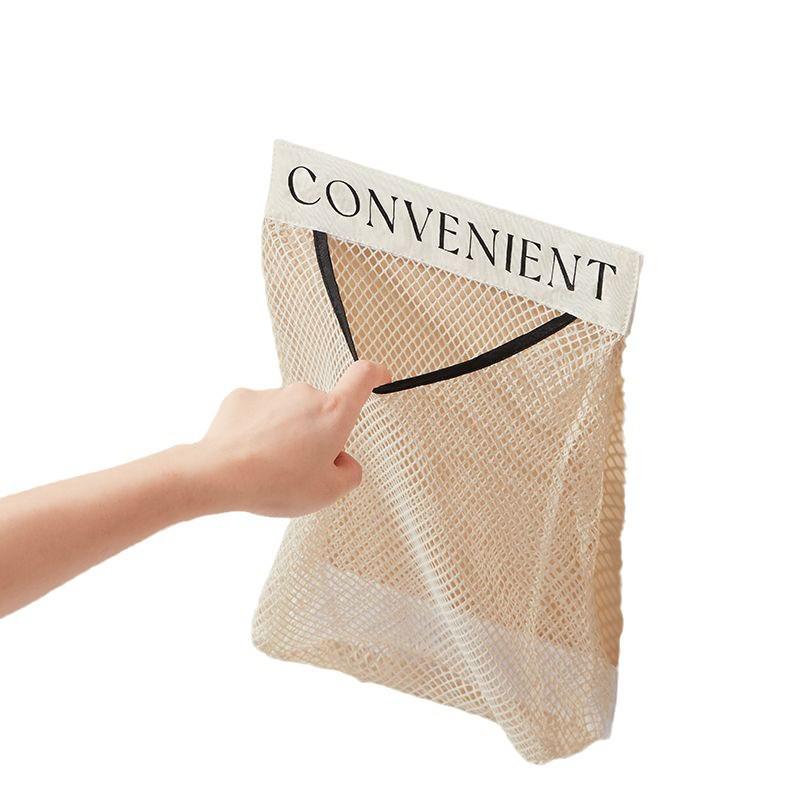 Wall-Mounted Kitchen Garbage Bag Storage: Large-Capacity, Multi-Functional Plastic Bag Organizer with Mesh Pocket for Cabinet Doors.