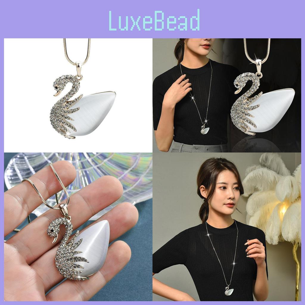 Elegante Schwanenhalskette für Damen mit Katzenaugenstein und Kristallanhänger im Stil