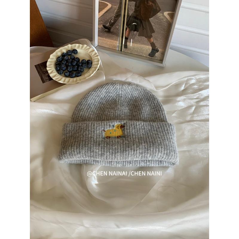 Embroidered Woolen Caps Are Cute for Children In Autumn and Winter. They Are Small Knitted Caps with Big Heads That Show Off Their Faces