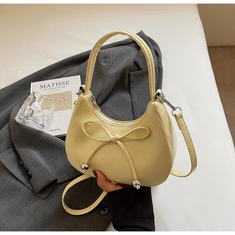 

Сумка-пельмень с ручкой-бантом, новый нишевый дизайн 2025, модная и повседневная однотонная сумка-мессенджер в зарубежном стиле жёлтый