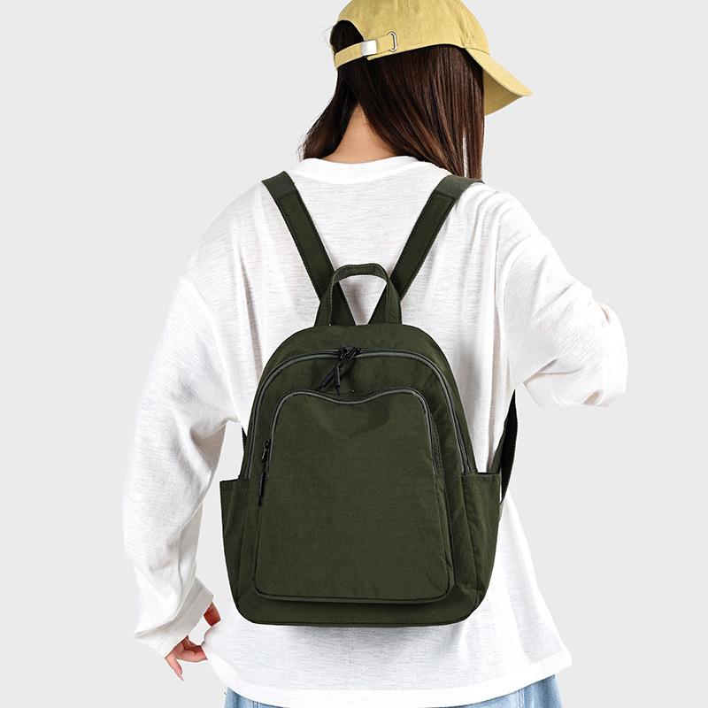 Schoolbag1011 New Simple Casual Backpack Women's Versatile Commuter Large Capacity Backpack Go Out and Play Lightweight Mountaineering Bag