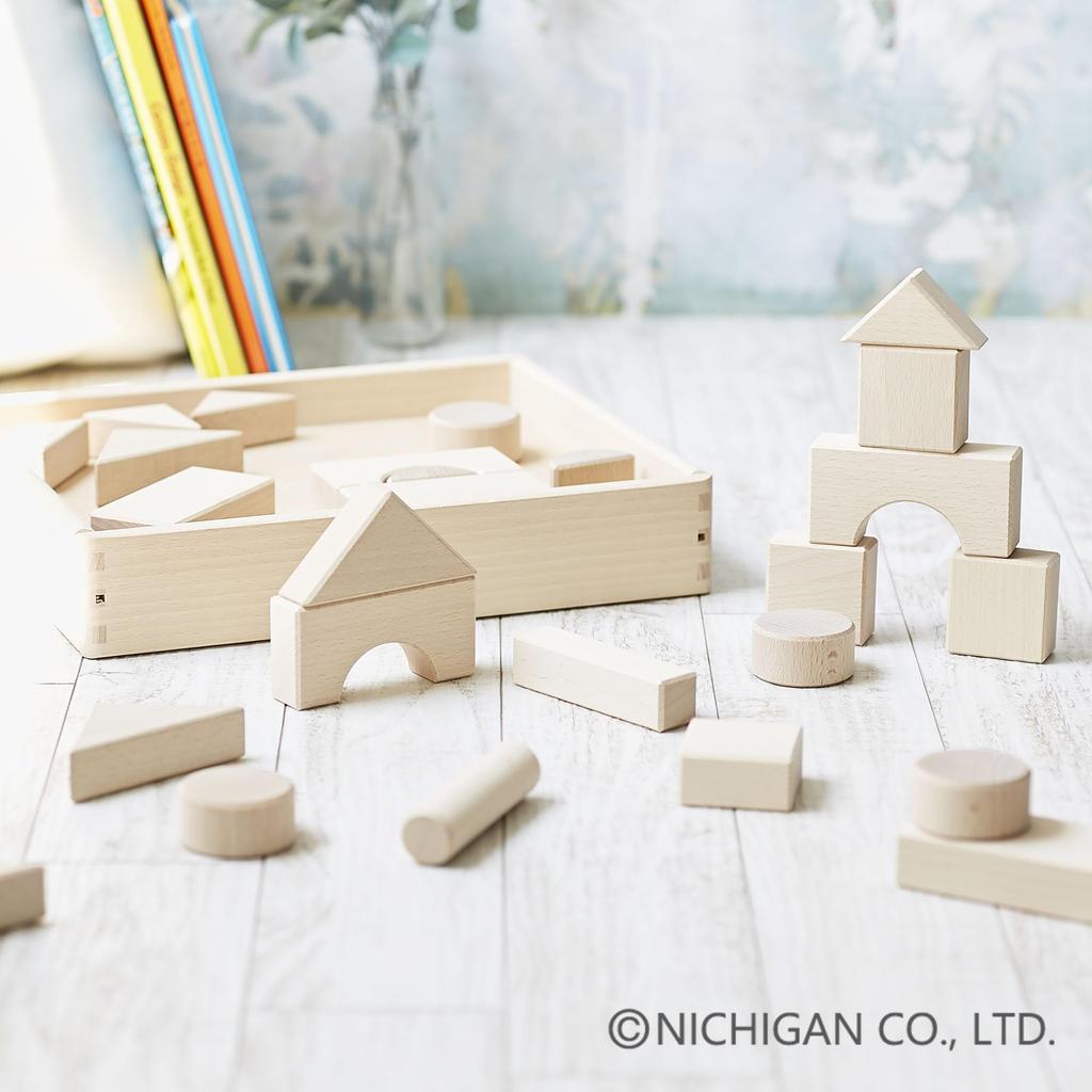 Made in Japan from natural wood, unpainted building blocks. Nichigan U1 30-piece set with wooden storage box.