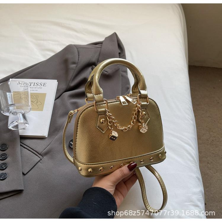 

Niche design handbag bag women s rivet decoration shell bag pu commuter shoulder crossbody bags золотой