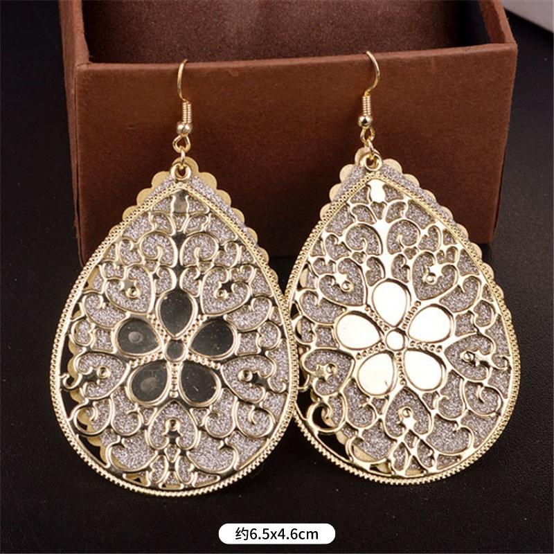 Fashion exaggerated niche temperament fringed earrings retro personality versatile sequined earrings women's long ear jewelry