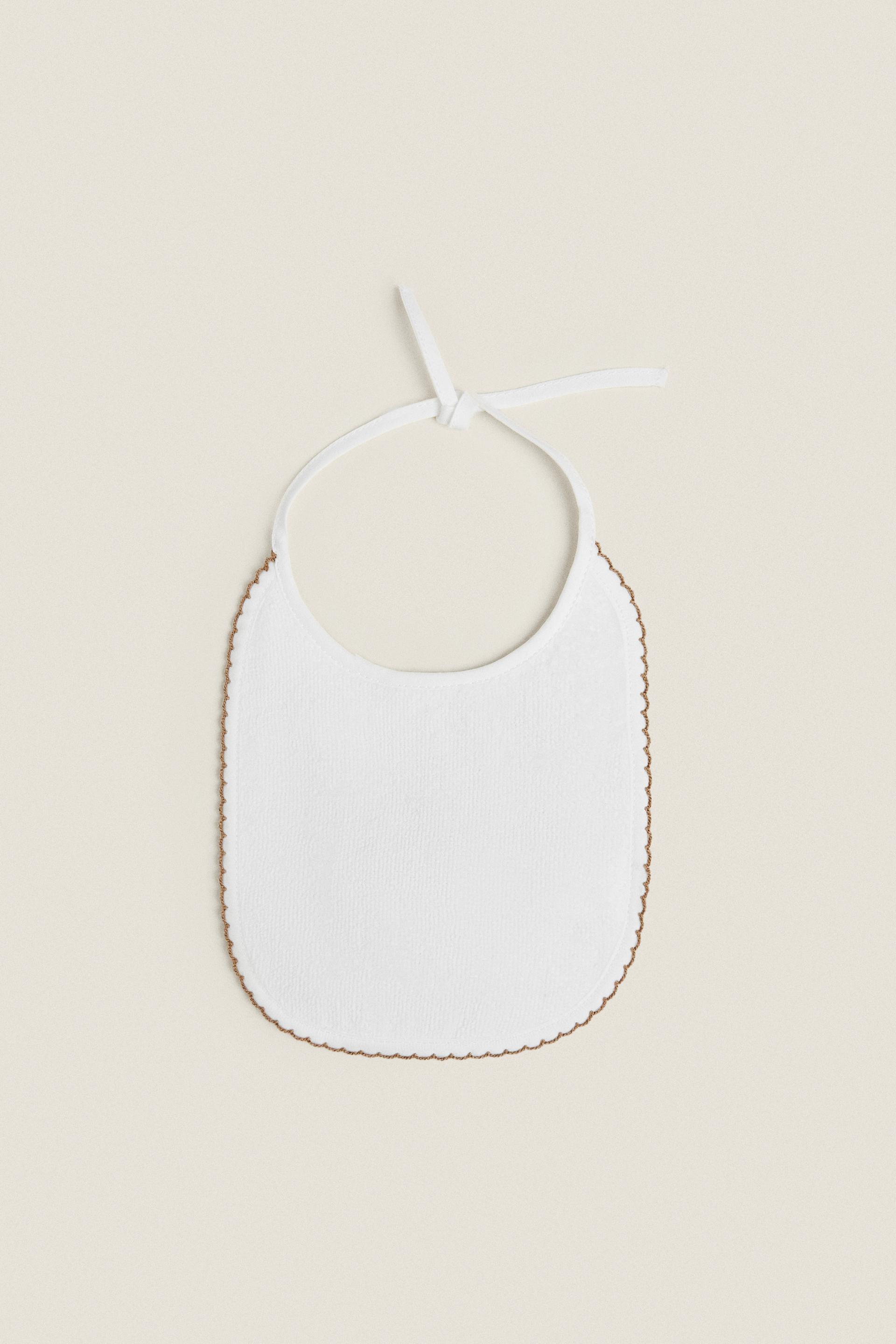 

VELOUR BIB WITH TRIM DETAIL