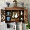 Rustic wooden wall cabinet with drawers and hooks