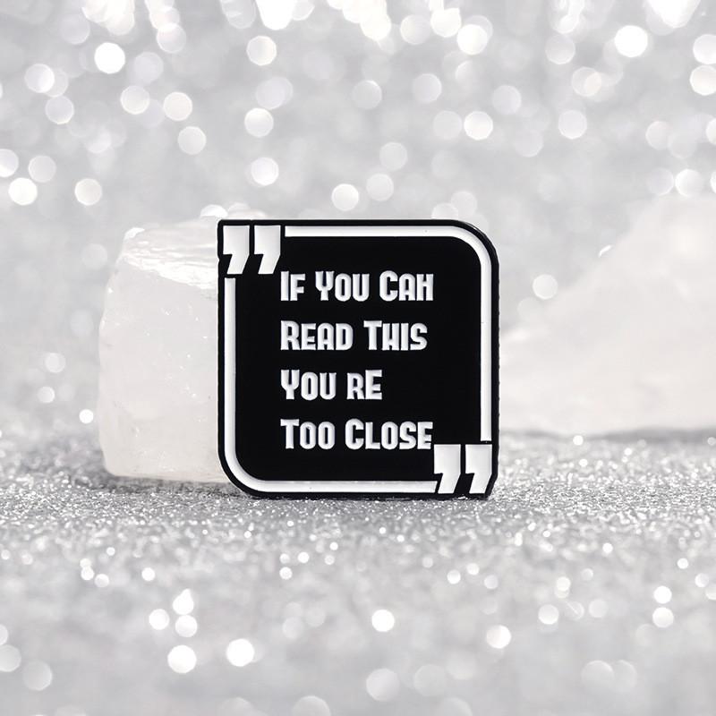 And Black Contemporary White Enamel Pin Brooch With Cartoon Design Perfect For Unisex Wear Casual