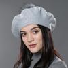 A Women's Beret Knitted Wool Hat with Fur Ball, Fashionable European and American Popular Hat, Autumn and Winter Thick Ear Protection Wool Hat