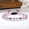 Adjustable Evil Eye Pendant Bracelet with Creative Bead and Woven String Design
