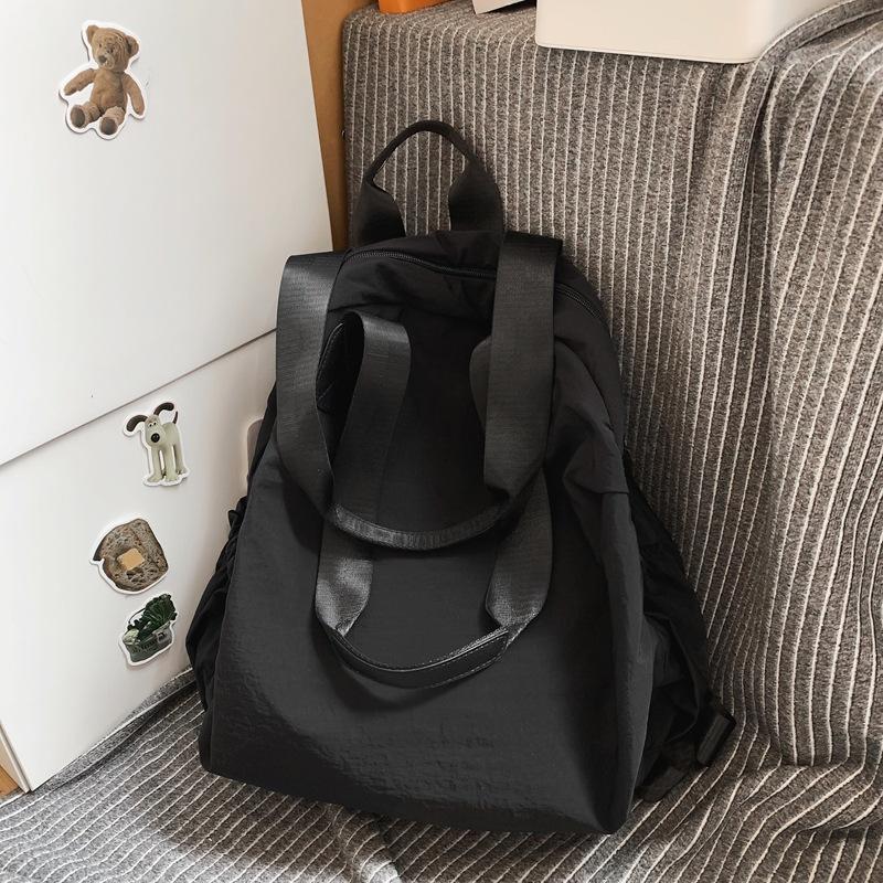 

Повседневный рюкзак большой вместимости женский новый литературный и простой наплечный мешок нишевый дизайн легкий рюкзак чёрный