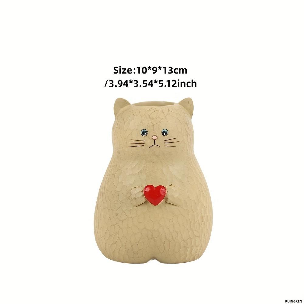 A cat shaped storage pen holder with heart-shaped decorative statues and multifunctional vase decorations