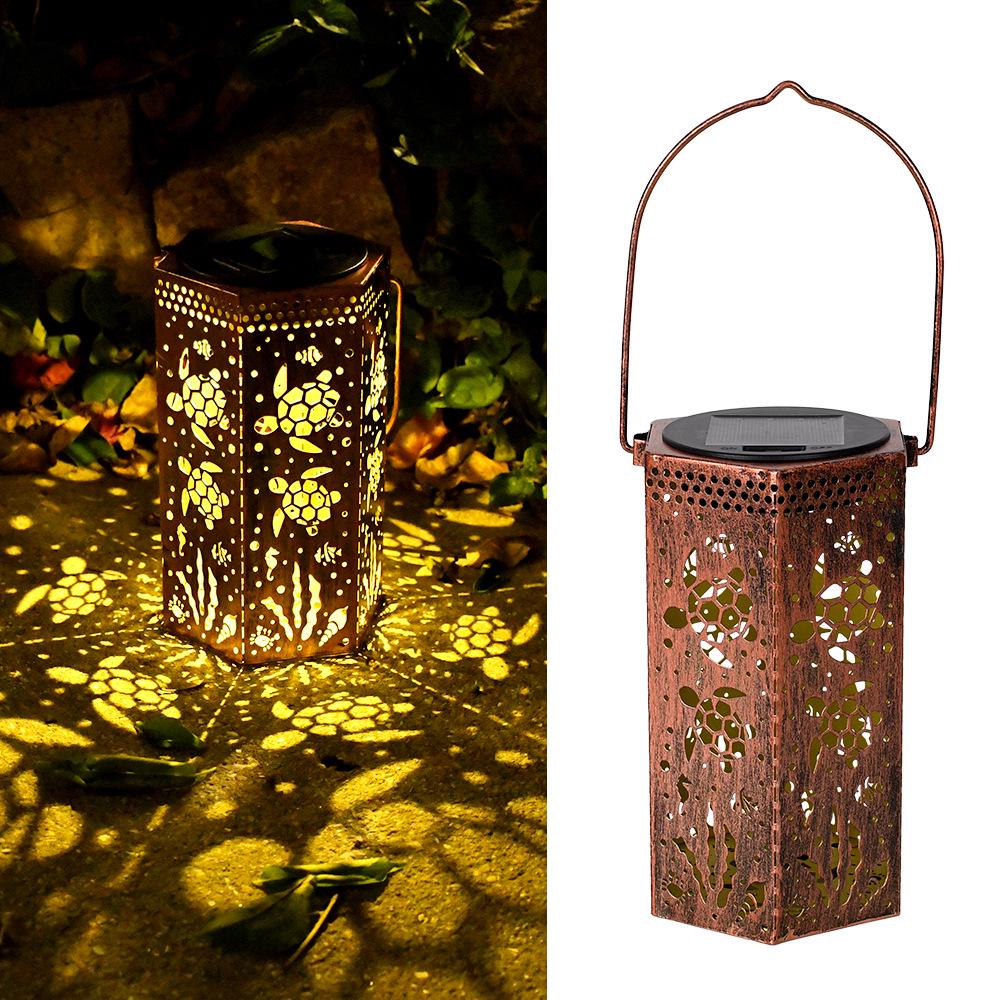 Outdoor Solar Wrought Iron Lantern: Waterproof Hollow Projection Table Lamp for Courtyard and Garden