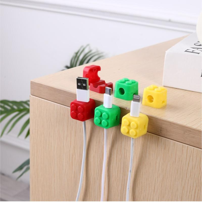 Building block fixed cable device, data cable buckle magnetic suction cable manager, desktop cable manager, buckle hub, mobile phone cable storage