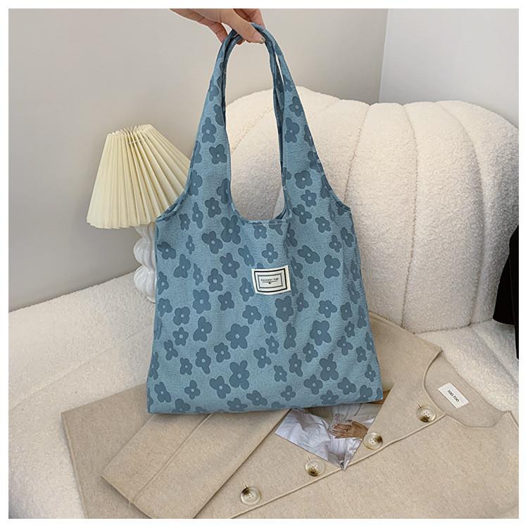 

Elegant And Practical Medium Sized Handheld Tote Bag For Women With Floral Accents Blue