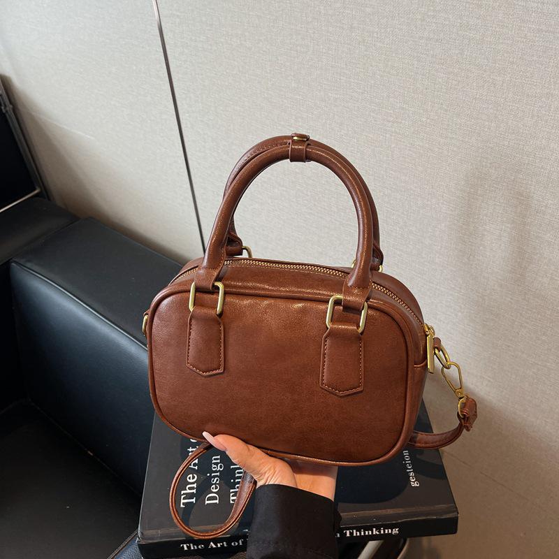 

Новая универсальная сумка для боулинга Boston: Шикарная сумочка в стиле хай-энд для женщин темно-коричневого