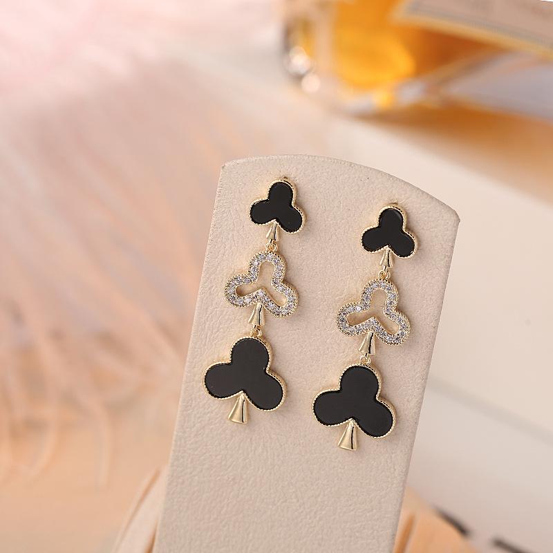 

Creative Bestseller: Black and White Hollow Zircon Christmas Tree and New Year Gift Earrings золотой