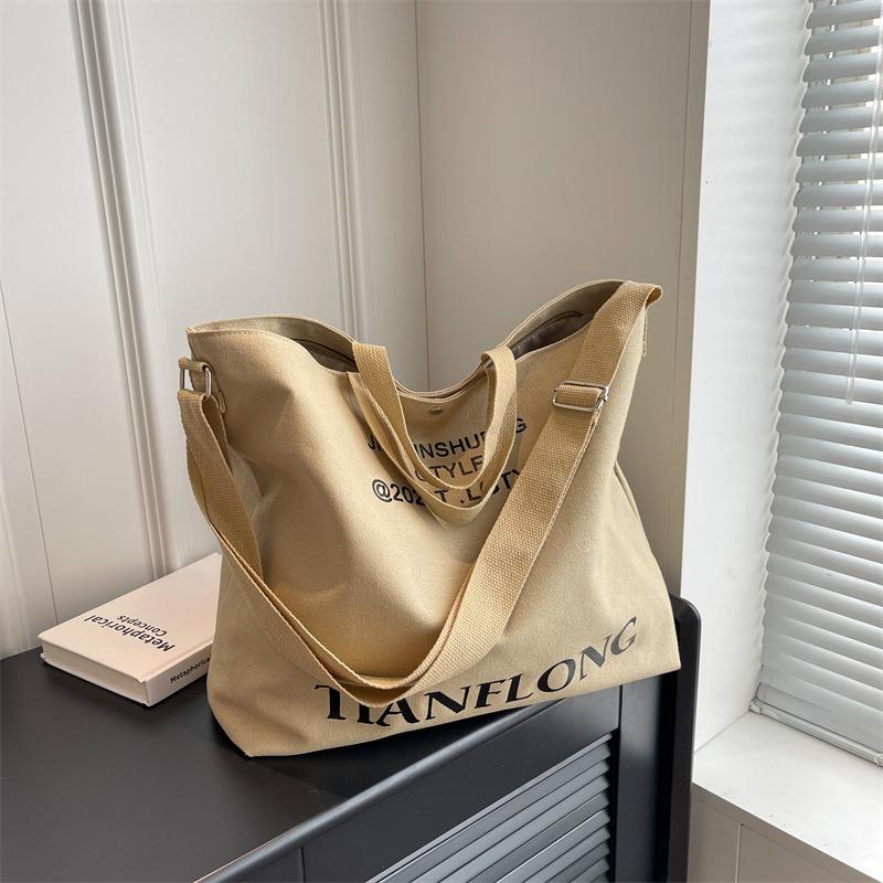 

Large-capacity bag Female versatile student class bag New textured canvas messenger bag Portable commuter bucket bag світлого кольору хакі