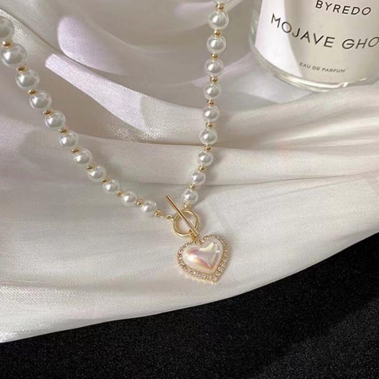 New super fairy temperament imitation pearl love necklace in Japan and South Korea, cold wind, sweet and simple OT buckle collarbone chain woman