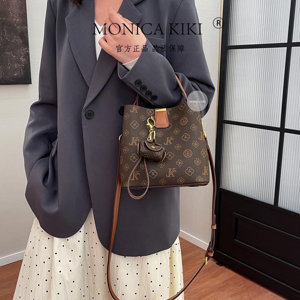 Light luxury niche bag women 2025 new super fire commuter old flower bucket bag foreign style versatile messenger bag