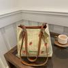 Versatile seaside beach vacation straw bag 2025 new shoulder large capacity fashionable strawberry embroidered bucket bag