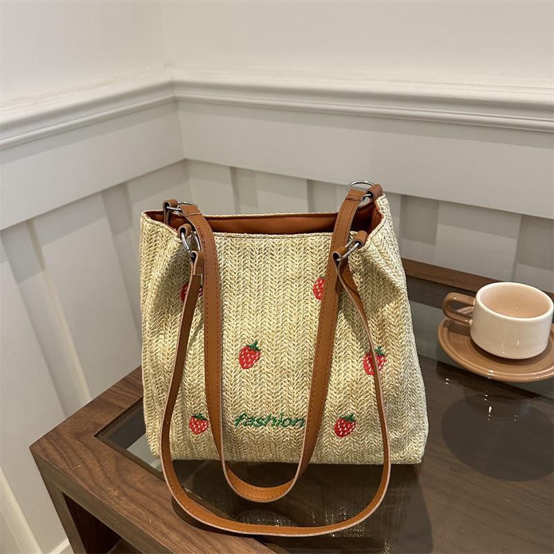 Versatile seaside beach vacation straw bag 2025 new shoulder large capacity fashionable strawberry embroidered bucket bag
