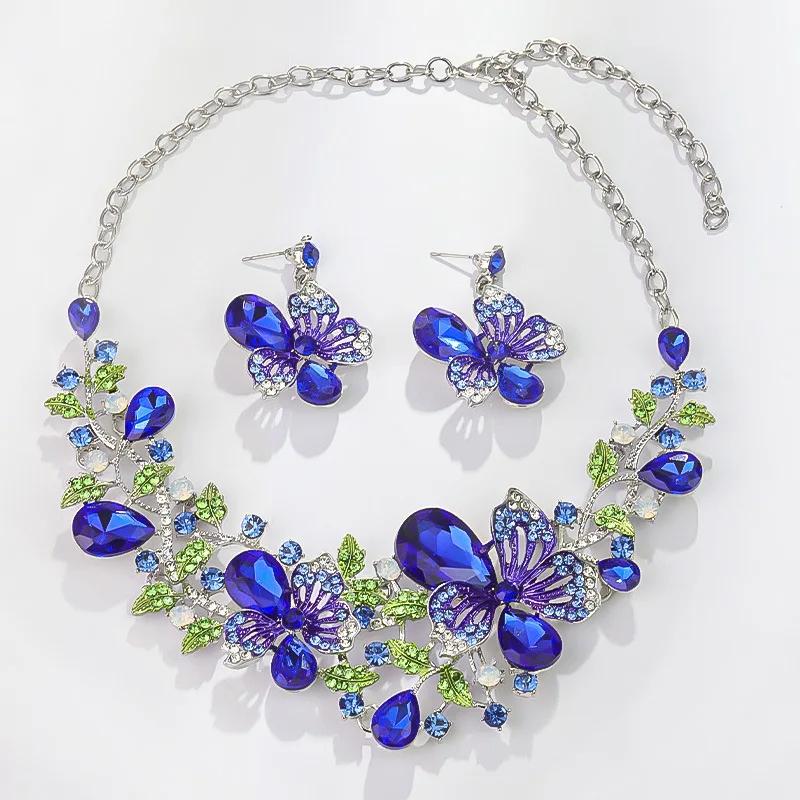 

Многоцветные серьги с подходящим ожерельем Модные цветы баухинии Кристальный циркониевый набор Свадебное ожерелье Женский циркон синий