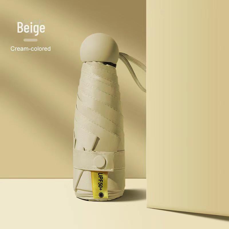 50 % rabatt på svart kapselparaply i lommeformat - Seks-skjerms sammenleggbar for sol og regn