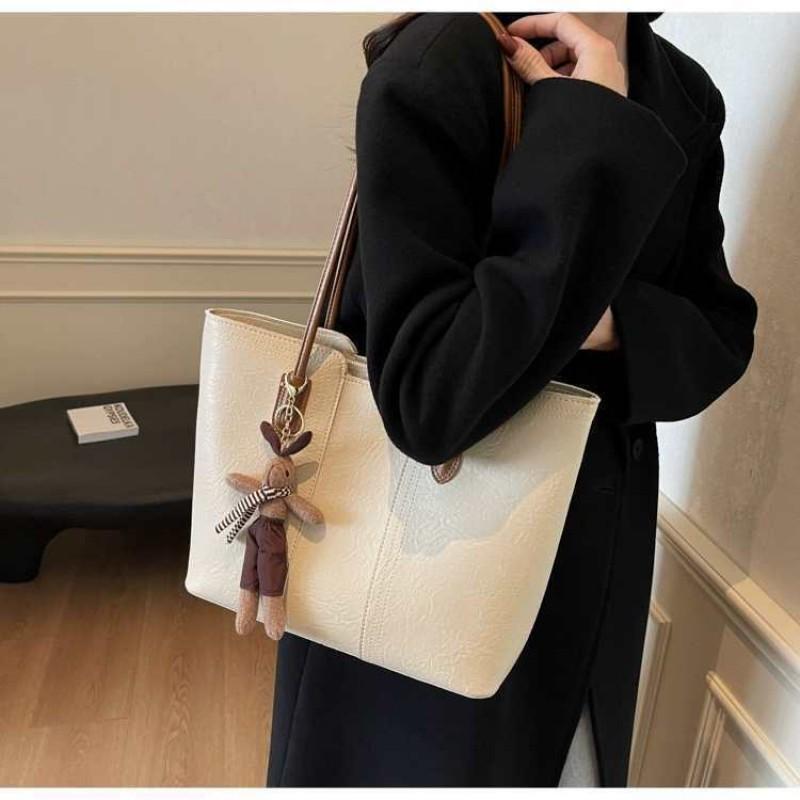 Hochwertige Retro-Tasche mit großem Fassungsvermögen, modische Damen-Umhängetasche für Pendler, beliebte Tragetasche
