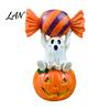 Whimsical Ghost Statue Halloween Figurine, Cute Sitting on Pumpkin Holding Candy Souvenir Gift Statue, Spooky Resin Table Ornament for Indoor