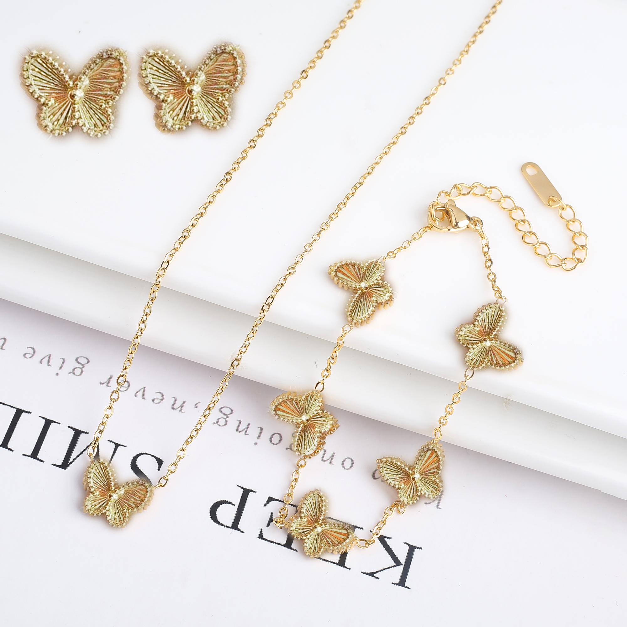 

Высококачественный Металл Нержавеющая Сталь Лазер Бабочка Циркон Набор Браслет Ожерелье Серьги Роскошный для Женщин Вечеринка Циркон Клевер