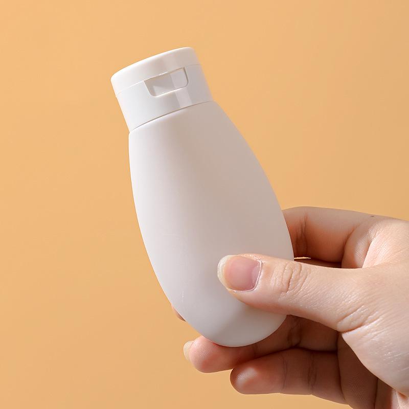 Portable 60ml Travel Dispenser Bottle for Shampoo, Shower Gel, and Facial Cleanser