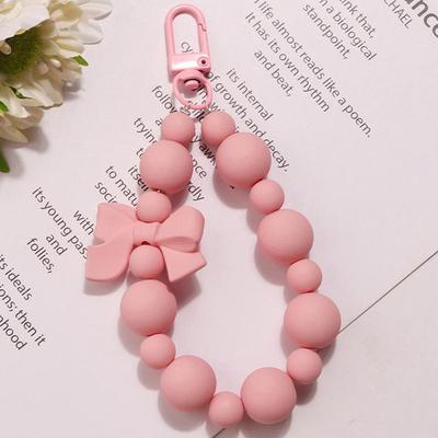 Süße rosa Schleife Perlen Schlüsselanhänger Handykette Kopfhörer Tasche Charms Anti-Lost Seil Auto Schlüsselanhänger Rucksack Anhänger Schmuck