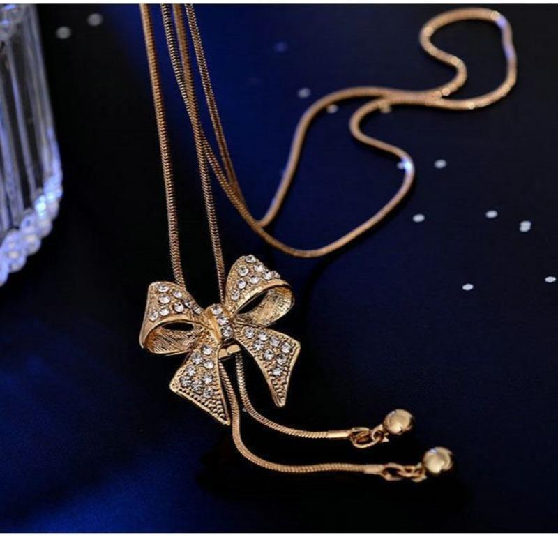 

Long bow sweater chain for women, versatile high-end fringed chain, autumn and winter clothes accessories pendant