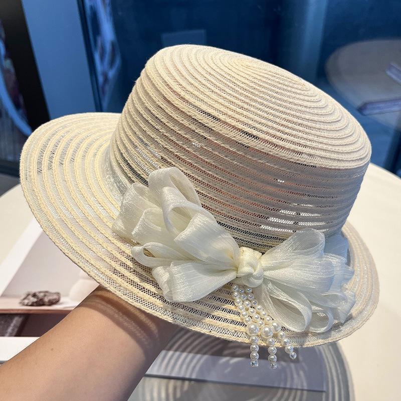 New bow pearl decoration women's summer face covering sunscreen straw hat British retro sunshade fashionable and elegant mesh gauze hat