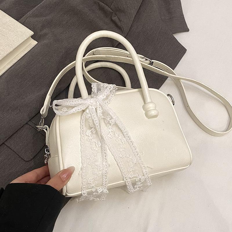 Korean version of the hot sale niche simple solid color hand pillow bag versatile fashion high texture commuter messenger bag women