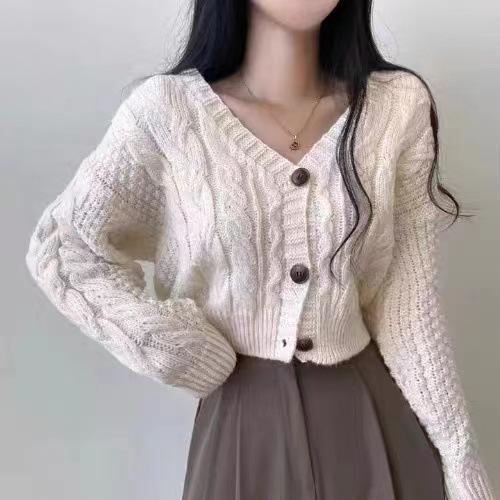 Short twist knitted sweater women's coat autumn new design sense knitted solid color long-sleeved cardigan women