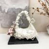 Niche pleated bow dumpling bag women's 2026 spring new Korean light luxury texture shoulder armpit bag