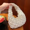 Borsa da sera in perle temperamentali delicate con design traforato, nuova borsa a sacchetto in raso perlate, borsa a tracolla portatile a forma di raviolo