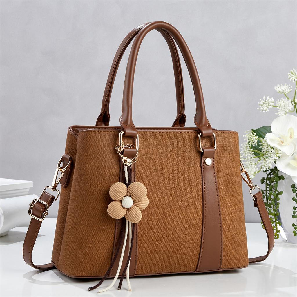 Simple commuting classic flower tassel decorative handbag new gentle temperament crossbody shoulder