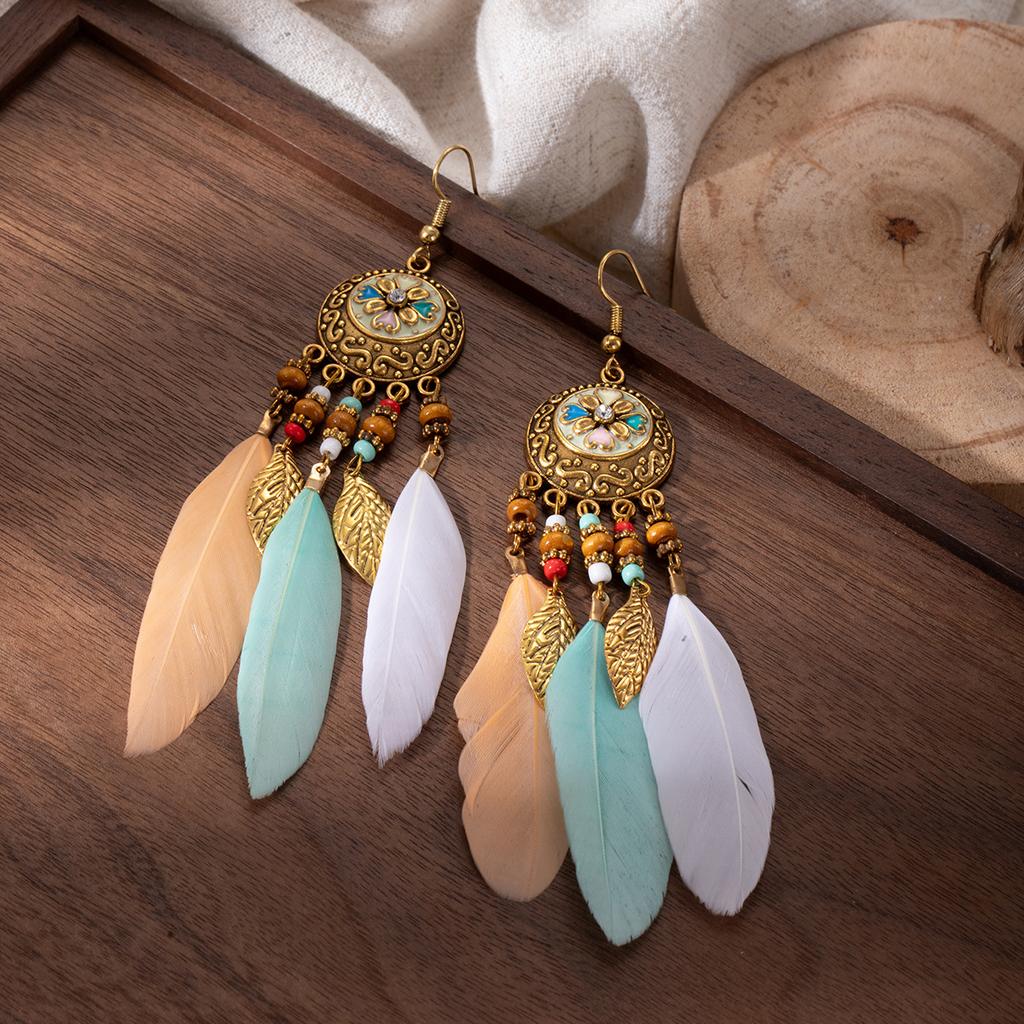 Retro ethnic style woven feathers long fringed earrings, bohemian high-end hollow rice bead earrings