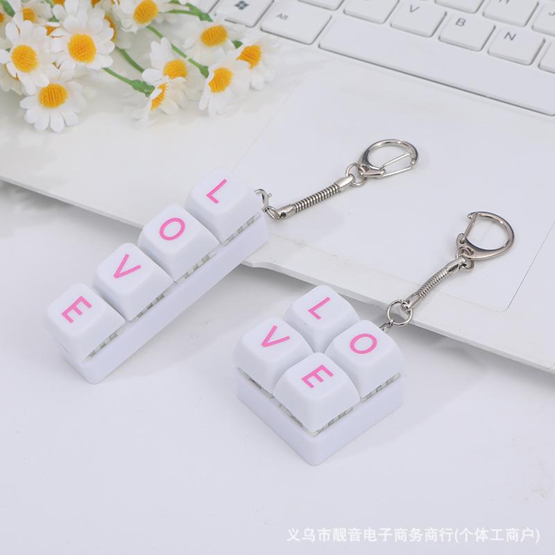 

Korean version of Kawaii decompression 4-key square Macaron keyboard pendant fingertip pressing creative accessories letter toy слонова кістка