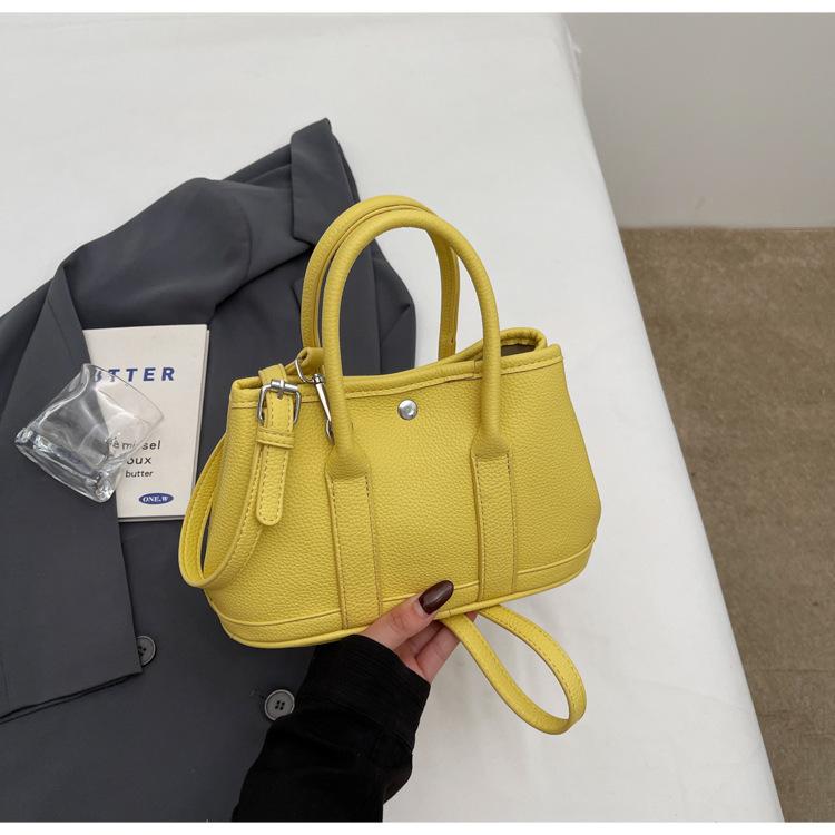 2025 New Niche Simple Leisure Commuter Portable Bucket Bag Versatile Solid Color Child and Mother Bag Messenger Bag Bag