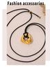 Qiong Yao Stainless Steel Curved Pendant Necklace with Black Leather Cord, Adjustable Length, Simple High-End Design for Women.